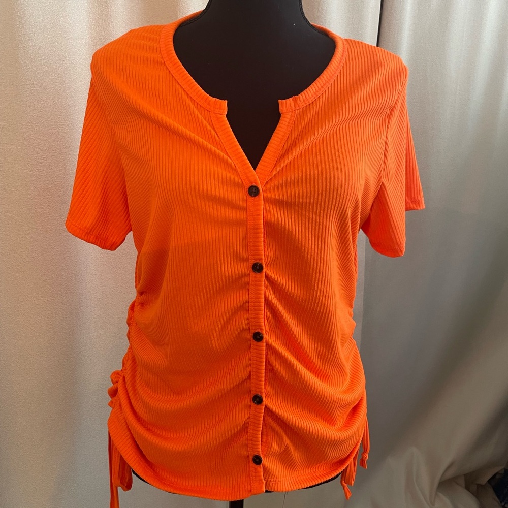 Orange Top with Fake Buttons down the front with 2 gathering Ties on both Sides